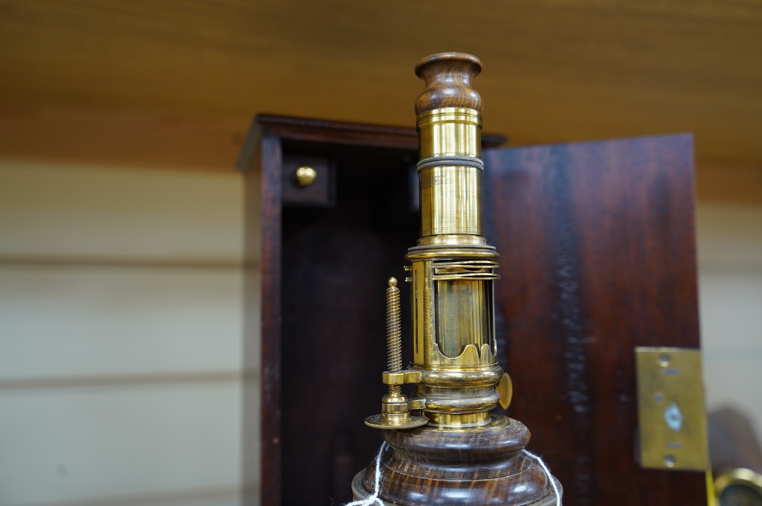 A cased reproduction W.R. Feat 18th century Culpeper style brass microscope, 20cm high, spare lenses in drawer of case. Condition - good.